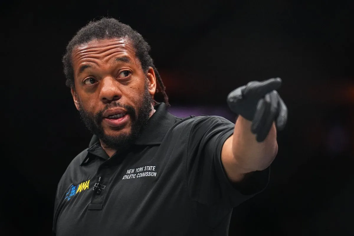 Referee Herb Dean seen in the Octagon during the UFC 322 event at Madison Square Garden